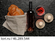 Traditional challah bread with wine and candles on dark background. Shabbat Shalom. Стоковое фото, фотограф Pixel_shot / Фотобанк Лори