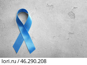Blue ribbon on grey background. Prostate cancer concept. Стоковое фото, фотограф Pixel_shot / Фотобанк Лори