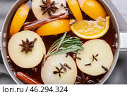 Saucepan with hot mulled wine on table, closeup. Стоковое фото, фотограф Pixel_shot / Фотобанк Лори