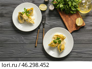 Plates with tasty conchiglioni pasta on table. Стоковое фото, фотограф Pixel_shot / Фотобанк Лори