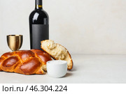 Traditional challah bread with wine on white background. Shabbat Shalom. Стоковое фото, фотограф Pixel_shot / Фотобанк Лори