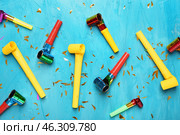 Birthday party whistles on color background. Стоковое фото, фотограф Pixel_shot / Фотобанк Лори
