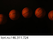 Stroboscopic photo of moving ball on dark background. Стоковое фото, фотограф Pixel_shot / Фотобанк Лори