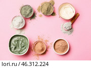 Frame made of cosmetic clays in bowls on color background. Стоковое фото, фотограф Pixel_shot / Фотобанк Лори