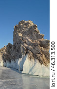 Vertical video of frozen Baikal Lake in winter sunny day. View of natural landmark Dragon Cape on edge of Ogoy Island from Small Sea Strait ice surface. Popular place of tourists. Scenic landscape. Стоковое видео, видеограф Виктория Катьянова / Фотобанк Лори