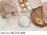 Plate with rice flour and products on white table. Стоковое фото, фотограф Pixel_shot / Фотобанк Лори