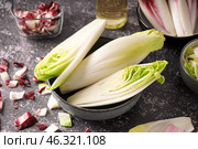 Bowl of fresh endive on grunge background. Стоковое фото, фотограф Pixel_shot / Фотобанк Лори