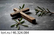 Religion, faith, liturgy, Ash Wednesday. Great lent. A wooden cross, a ceremonial bowl made of ash and an olive branch on a gray background. Стоковое AI-изображение, AI-художник Photojuli / Фотобанк Лори