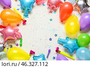 Composition with festive air balloons and party whistles on light background. Стоковое фото, фотограф Pixel_shot / Фотобанк Лори