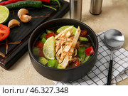 Bowl of tasty Sopa de Lima soup on table. Стоковое фото, фотограф Pixel_shot / Фотобанк Лори
