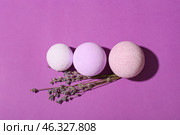 Bath bombs and lavender flowers on color background. Стоковое фото, фотограф Pixel_shot / Фотобанк Лори