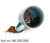 Cup with spent coffee grounds for fortune telling on white background. Стоковое фото, фотограф Pixel_shot / Фотобанк Лори