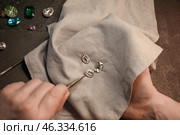 Jeweler examining gemstone in workshop, closeup. Стоковое фото, фотограф Pixel_shot / Фотобанк Лори