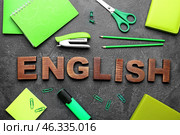 Composition with stationery and text ENGLISH on grey background. Стоковое фото, фотограф Pixel_shot / Фотобанк Лори
