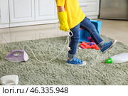 Little boy playing with cleaning supplies and iron at home. Стоковое фото, фотограф Pixel_shot / Фотобанк Лори