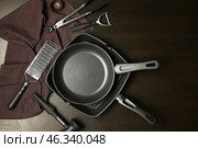 Set of kitchenware on dark background. Стоковое фото, фотограф Pixel_shot / Фотобанк Лори