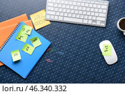 Computer keyboard with stationery and sticky notes on color background. April Fool's Day prank. Стоковое фото, фотограф Pixel_shot / Фотобанк Лори