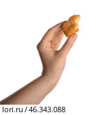 Female hand with tasty nugget on white background. Стоковое фото, фотограф Pixel_shot / Фотобанк Лори