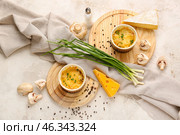 Ramekins with tasty julienne and ingredients on light background. Стоковое фото, фотограф Pixel_shot / Фотобанк Лори