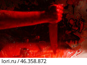 View at maniac's hand with knife through bloodstained glass. Стоковое фото, фотограф Pixel_shot / Фотобанк Лори