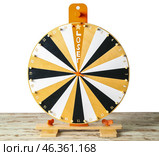 Spinning wheel with word LOSER on table against white background. Стоковое фото, фотограф Pixel_shot / Фотобанк Лори
