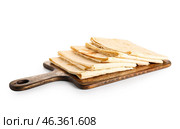 Wooden board with fresh thin lavash on white background. Стоковое фото, фотограф Pixel_shot / Фотобанк Лори