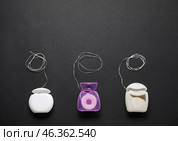 Different dental floss on black background. Стоковое фото, фотограф Pixel_shot / Фотобанк Лори