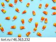Tasty Halloween candy corns on blue background. Стоковое фото, фотограф Pixel_shot / Фотобанк Лори