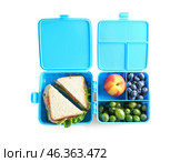 Lunchboxes with yummy food isolated on white background. Стоковое фото, фотограф Pixel_shot / Фотобанк Лори