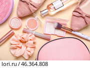 Silk scrunchy, female accessories and cosmetics on color background. Стоковое фото, фотограф Pixel_shot / Фотобанк Лори
