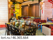 Interior of a cozy restaurant in oriental style (2023 год). Редакционное фото, фотограф Евгений Ткачёв / Фотобанк Лори