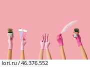 Many female hands with razors, liposoluble wax cartridges, plants and feather on pink background. Depilation concept. Стоковое фото, фотограф Pixel_shot / Фотобанк Лори