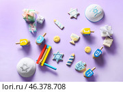 Different symbols of Hanukkah on color background. Стоковое фото, фотограф Pixel_shot / Фотобанк Лори