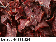 Spicy beef jerky as background. Стоковое фото, фотограф Pixel_shot / Фотобанк Лори