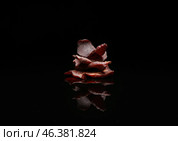 Spicy beef jerky on dark background. Стоковое фото, фотограф Pixel_shot / Фотобанк Лори