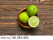 Bowl of ripe bergamot fruits on wooden background. Стоковое фото, фотограф Pixel_shot / Фотобанк Лори