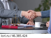 Man and lawyer shaking hands in office. Стоковое фото, фотограф Pixel_shot / Фотобанк Лори