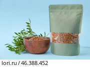 Bag and bowl with buckwheat groat on color background. Стоковое фото, фотограф Pixel_shot / Фотобанк Лори
