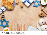 Frame made from different Hannukah symbols on beige table. Стоковое фото, фотограф Pixel_shot / Фотобанк Лори