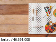 Pegboard with drawing tools on wooden wall. Стоковое фото, фотограф Pixel_shot / Фотобанк Лори