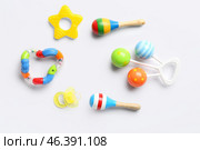 Baby rattles and pacifier on white background. Стоковое фото, фотограф Pixel_shot / Фотобанк Лори