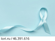Satin ribbon on light blue background. Prostate cancer concept. Стоковое фото, фотограф Pixel_shot / Фотобанк Лори