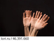 Stroboscopic photo of moving female hand on dark background. Стоковое фото, фотограф Pixel_shot / Фотобанк Лори
