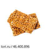 Tasty peanut brittle on white background. Стоковое фото, фотограф Pixel_shot / Фотобанк Лори