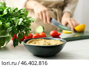 Bowl with tasty baba ghanoush on table, closeup. Стоковое фото, фотограф Pixel_shot / Фотобанк Лори