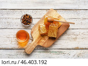 Jar of honey, combs and beebread on white wooden background. Стоковое фото, фотограф Pixel_shot / Фотобанк Лори