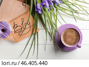 Sheet of paper with word BLOG, cup of coffee and flowers on white table. Стоковое фото, фотограф Pixel_shot / Фотобанк Лори