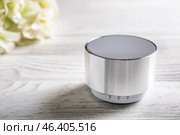 Smart home assistant device on white wooden table. Стоковое фото, фотограф Pixel_shot / Фотобанк Лори