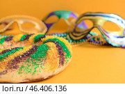 Festive cake for Mardi Gras (Fat Tuesday) holiday with decor on color background. Стоковое фото, фотограф Pixel_shot / Фотобанк Лори