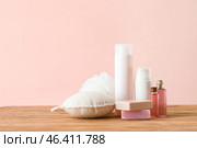 Cosmetics with bast wisps on wooden table. Стоковое фото, фотограф Pixel_shot / Фотобанк Лори